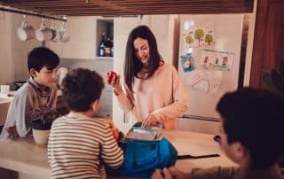 mother preparing healthy snacks for kids